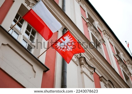 Poznan, Poland - December 2022: Greater Poland Uprising of 1918–1919 flag. Royalty-Free Stock Photo #2243078623