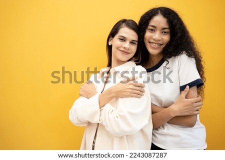 Embrace equity on multiracial Internal Women's Day. Lady diversity group good mood hands hug herself shoulders enjoy joyful soft cloth laundry warmth toothy smile. Royalty-Free Stock Photo #2243087287