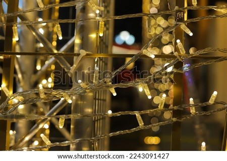Christmas winter background with shiny blurred lights. New year illumination