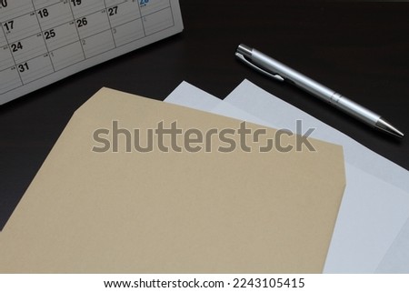 Photo of Envelope and Pen