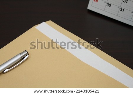 Photo of Envelope and Pen