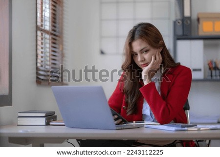 asian woman thinking hard concerned about online problem solution looking at laptop screen, worried serious asian businesswoman focused on solving difficult work computer task

