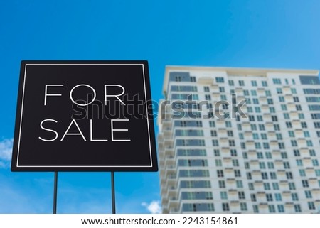 A for sale sign of a RFO or Ready for Occupancy condominium unit. Real estate concept, brand new, or resale.