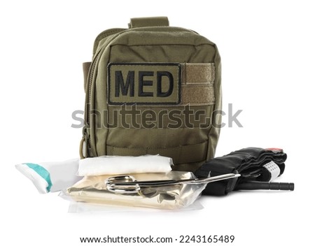 Military first aid kit with items isolated on white