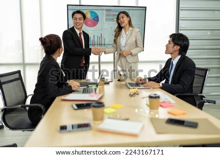 Employee meeting big screen tv presentation conference discussion brainstorming and working together