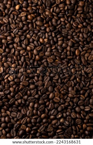 Roasted coffee beans background. Healthy beverage ingredients

