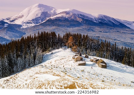 Beautiful winter landscape with snow-covered buildings in Carpathians, Ukraine