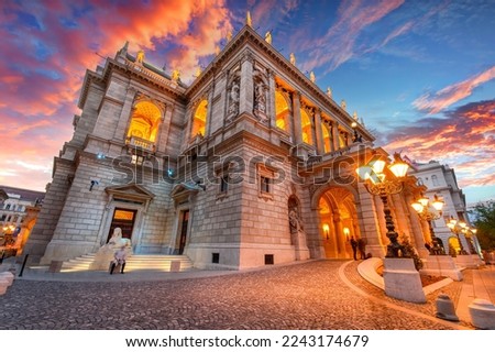 The Hungarian Royal State Opera House in Budapest, Hungary at sunset, considered one of the architect's masterpieces and one of the most beautiful in Europe. Royalty-Free Stock Photo #2243174679