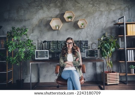 Photo of cheerful confident lady coder wear glasses arms folded working modern device indoors workstation workshop