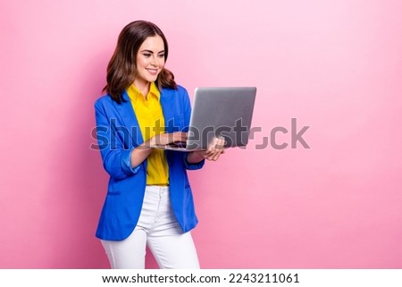 Photo of young concentrated business woman wear blue jacket formal clothes typing laptop browsing google search isolated on pink color background