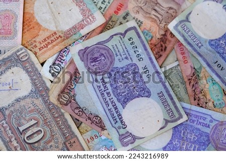 Vintage Old Indian Currency, A background of old vintage Indian currency notes. Royalty-Free Stock Photo #2243216989