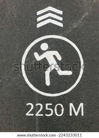 Sign indicating the distance of 2,250 cm on the asphalt at the park's runway.