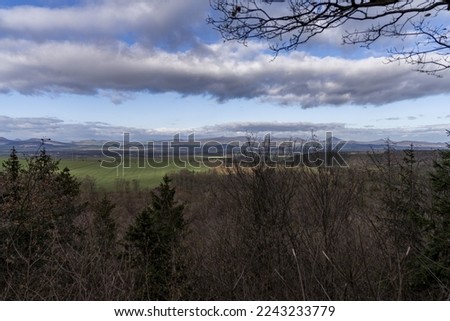 View from the Beautiful viewpoint near the town of Peruc on the hills of the Český středohoří in sunny weather in winter