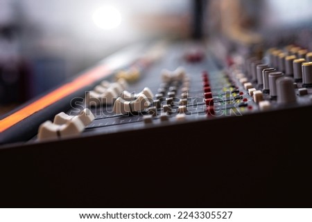 Professional digital audio channel mixer in studio. Sound control panel closeup