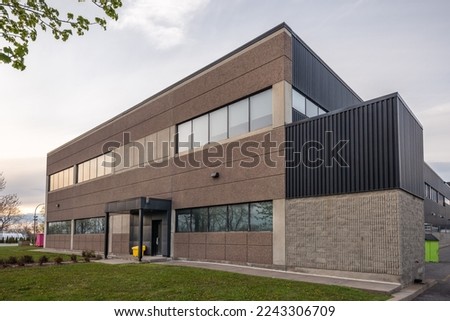 Angle view of a small business building exterior Royalty-Free Stock Photo #2243306709