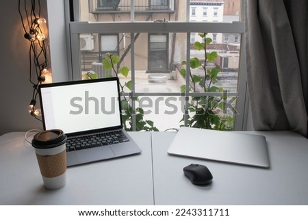 Home office, desktop with laptops and a cup of coffee, freelancer workplace, distant work, work from home, 