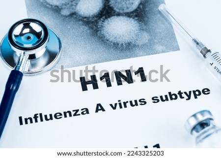 Close up of Influenza A virus subtype H1N1 word disease and stethoscope,Medical health concept Royalty-Free Stock Photo #2243325203