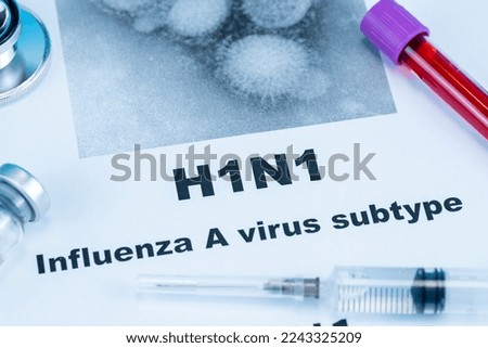 Close up of Influenza A virus subtype H1N1 word disease and stethoscope,Medical health concept Royalty-Free Stock Photo #2243325209