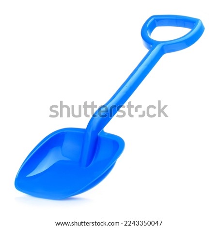 Children's large shovel isolated on a white background. Colored plastic shovels for snow removal. Children's Sandbox Toys