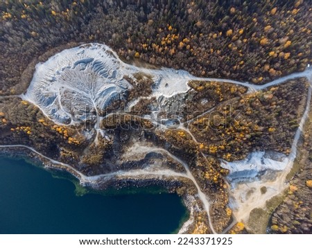 The autumn forest, lake, canyon, and quarry from above. The Ruskeala Park view from the drone.
