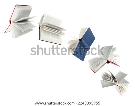 Many hardcover books flying on white background Royalty-Free Stock Photo #2243395955
