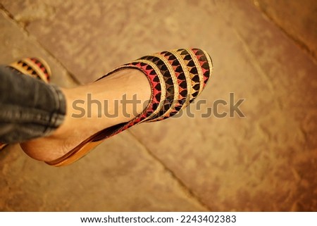 The women wearing traditional indian handmade footwear.