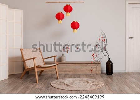 Interior of living room with armchair and decor for Chinese New Year celebration