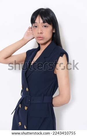 young woman in black dress poising ,Indoor studio shot on white background