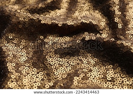 Beautiful golden sequin fabric as background, closeup