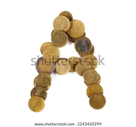 Euro metal coins in shape letter A isolated on white, top view