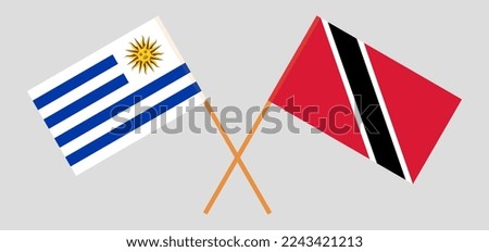 Crossed flags of Uruguay and Trinidad and Tobago. Official colors. Correct proportion. Vector illustration
