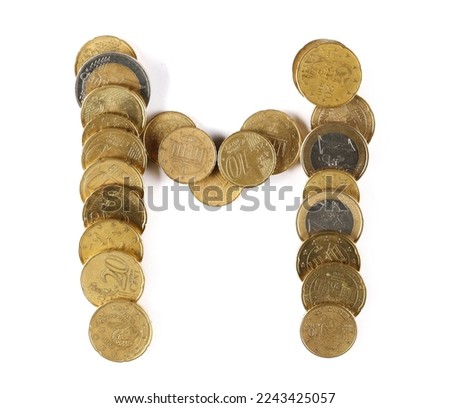 Euro metal coins in shape letter M isolated on white, top view