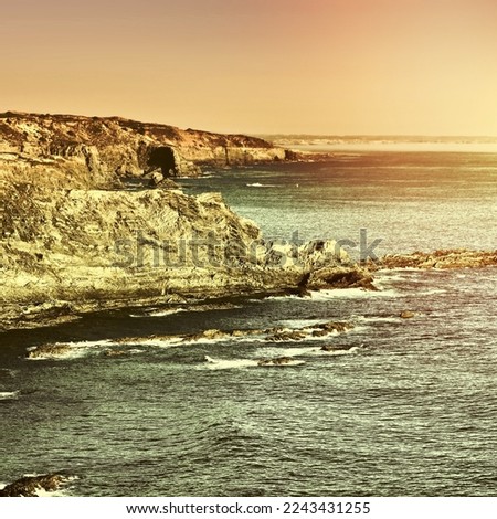 Rocky Coast of Atlantic Ocean in Portugal at Sunset, Vintage Style Toned Picture