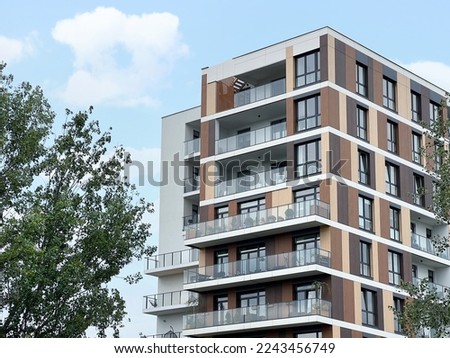 Exterior of beautiful building with balconies outdoors Royalty-Free Stock Photo #2243456749