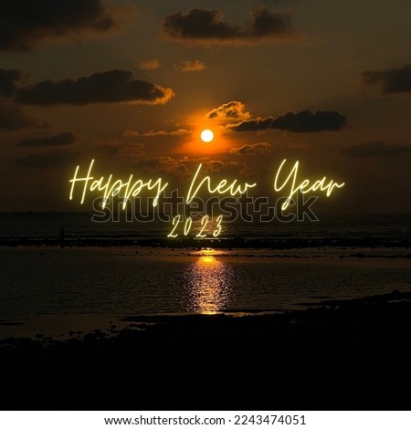 Happy new year 2023 in sunset with the sea and sky