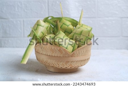Ketupat (Rice Dumpling) On White Background. Ketupat is a natural rice casing made from young coconut leaves for cooking rice during eid Mubarak, Eid Fitr