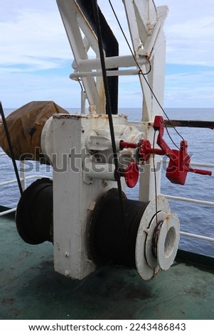Aru Archipelago- Indonesia, 30 December 2022 Roller mechanisms made of iron are used to lower ship lifeboats in emergencies. Royalty-Free Stock Photo #2243486843