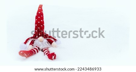 
Christmas gnome. Gnomes on a coniferous tree. Winter atmosphere snow, frost. Background for greeting cards. Magic aura.