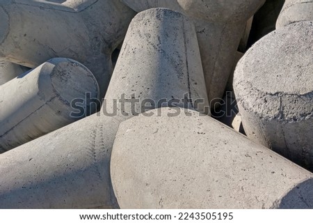 Tetrapods are shaped concrete blocks designed to protect the coastline from erosion Royalty-Free Stock Photo #2243505195
