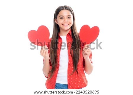 Teenage girl hold shape heart, heart-shape sign. Child holding a red heart love holiday valentine symbol, isolated on white background. Portrait of happy smiling teenage child girl.