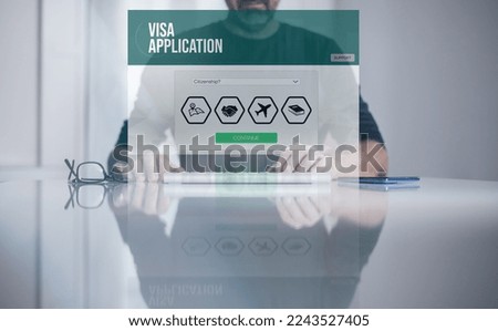 Man filling visa application form on laptop. Work recruitment, study, travel, immigration concept.