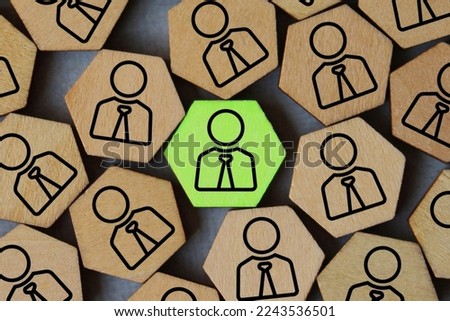 Human icon with green color stands out from the crowd. Talented, promotion, leader, chosen, hired concept Royalty-Free Stock Photo #2243536501