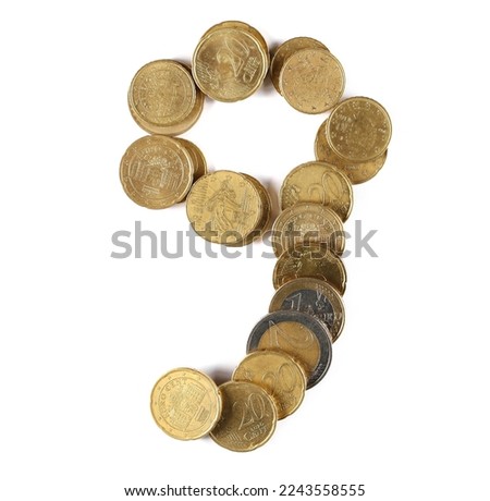 Euro metal coins in shape number 9, nine isolated on white, top view