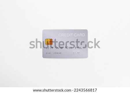Closeup of silver credit card mockup with security chip embedded isolated in white background. Royalty-Free Stock Photo #2243566817