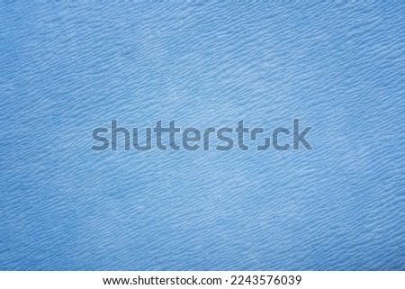 Beautiful abstract grunge decorative navy blue dark macro photography of paper background. Art rough stylized texture banner with space for text. Beautiful blue stucco wall background in cold mood.