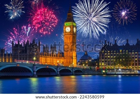 New years fireworks display over the Big Ben and Westminster Bridge in London, UK Royalty-Free Stock Photo #2243580599