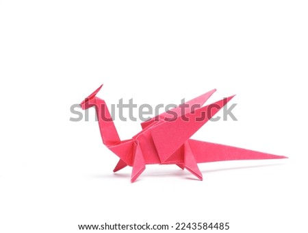 Paper origami dragon isolated on white background