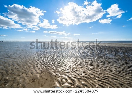 North Sea beach in Sankt Peter Ording, Germany Royalty-Free Stock Photo #2243584879