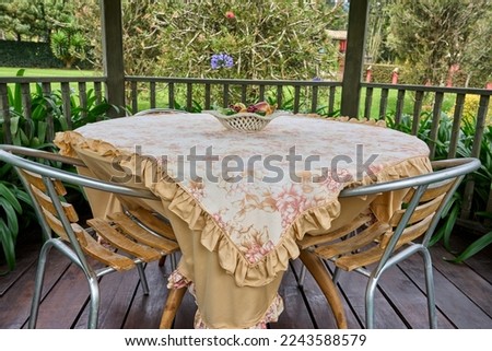 country table. country dining room. quiet space for dining. having breakfast in an outdoor dining room. dining inside the outdoor pergola. scenery at breakfast.                                  