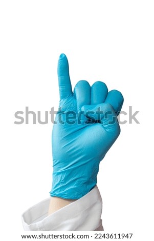 Close up of a doctor's hand wearing a latex glove doing the letter ¨i¨ in sign language